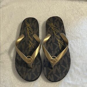 Michael Kors Black and Gold Flip Flops Size 7 Very Good Used Condition